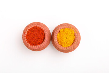 Red chili powder and turmeric powder in bowl
