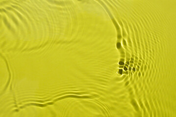 Water spills on a light green background. Natural sunlight and shade. Beautiful bursts. Summer mood. Minimal style.