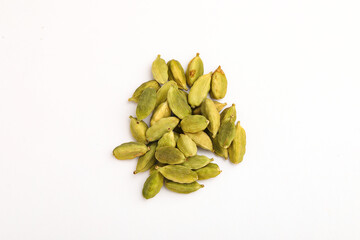 Fresh dried green cardamom seeds spice on white background