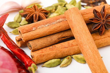 Indian spices and herbs on white background.