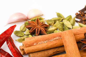 Indian spices and herbs on white background.