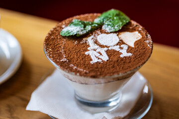 Classic tiramisu in a glass. Tiramisu with the inscription: 'I love NY'. Tiramisu - traditional italian dessert from mascarpone cheese and biscuit 