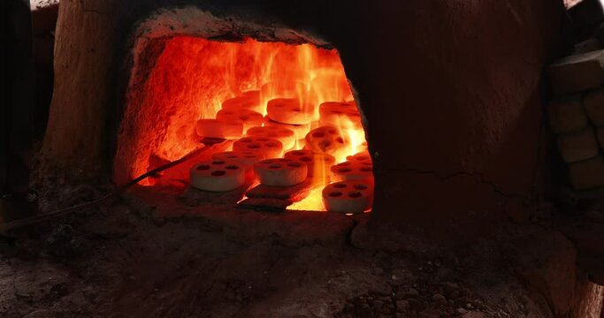 Handmade glass bead kiln oven fire Ghana. Historical handmade crushed glass beads made near, Accra, Ghana. Historic place to buy these rare art craft.