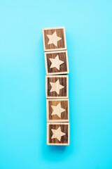 star symbol block on blue background. Service rating, ranking, customer review, satisfaction, evaluation and feedback concept