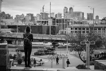 Young woman looking on cityscape 