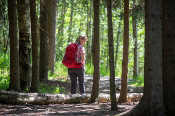 Woman hiking in forest in Finland