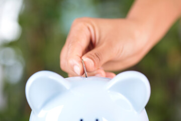 Put the change coin into the piggy bank