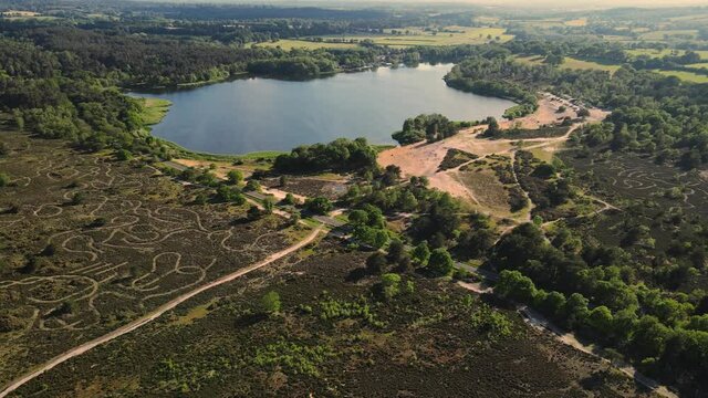 Aerial shot of a beautiful lake on a sunny day. Frensham ponds, UK