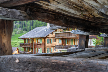 Fototapeta na wymiar Traditional wooden houses in Evolene, a village in the valley of Herens in the French-speaking part of the canton of Valais in Switzerland.