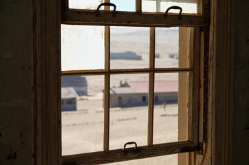kolmanskop ghost town, seen from one of the windows of an abandoned house