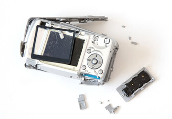 Broken old digital camera isolated, obsolete and not in use anymore