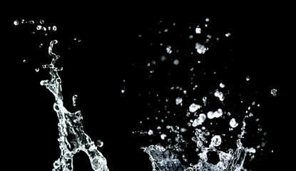 Water splashing isolated over black background