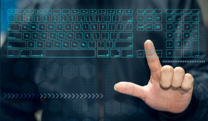 A young man uses his hands to type on a keyboard with a touch screen with modern advanced technology. Internet usage, smart button, search and work
