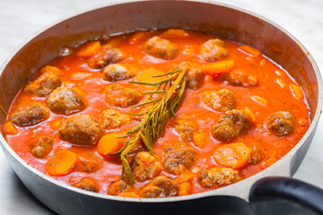meat balls in tomato sauce with carrot