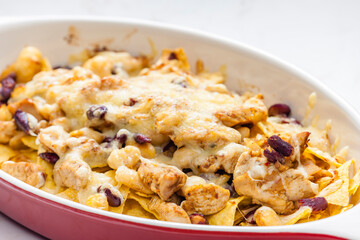 nachos with chicken meat, red beans and cheese