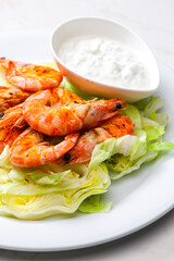 still lfe of grilled shrimps with garlic dip