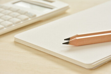 Blank notebook and a calculator