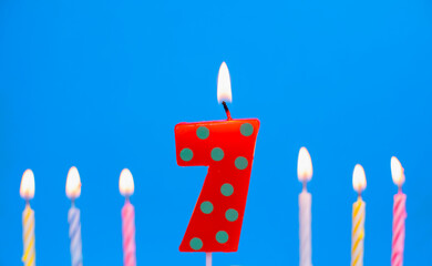 Burning birthday cake candle number 7. Happy Birthday background anniversary celebration concept
