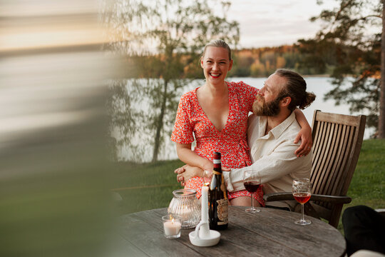Smiling couple sitting on patio