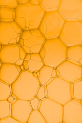Abstract background with hexagons shape on soup bubble on golden backgrounds.