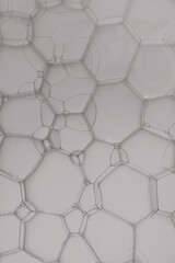 Abstract soap bubble pattern with light grey effect background.