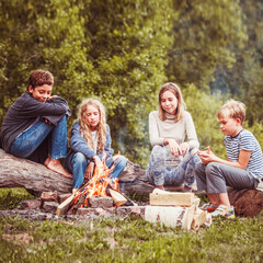 Children in the camp by the fire