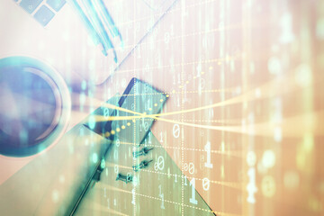 Multi exposure of data drawing hologram over topview of study desk background with computer. Concept of technology.