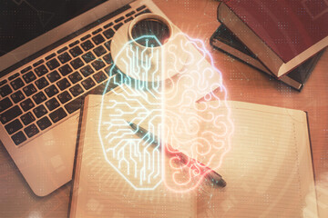 Double exposure of brain drawing hologram over topview work table background with computer. Concept of big data.