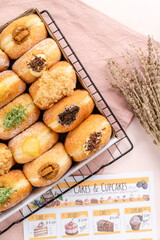 A bombolone or bomboloni is an Italian filled doughnut and is eaten as a snack food and dessert. This Bomboloni has many flavors like strawberry, chocolate, blueberry, etc.