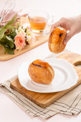 A bombolone or bomboloni is an Italian filled doughnut and is eaten as a snack food and dessert. This Bomboloni has many flavors like strawberry, chocolate, blueberry, etc.