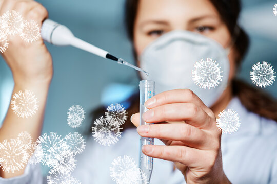Female scientist filling liquid in test tube