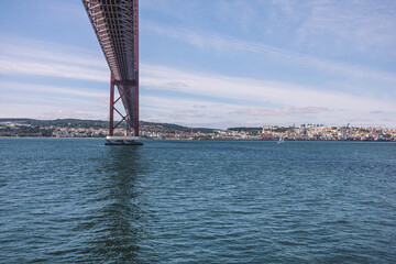 Fototapeta premium wide panorama of the river with beautiful blue water and a large bridge over the river
