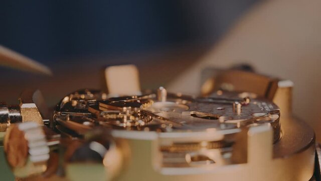 Watchmaker Assembling And Putting Back In Place The Piece And Mechanism Of Mechanical Watch By Tweezers. - acro