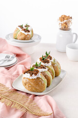 A bombolone or bomboloni is an Italian filled doughnut and is eaten as a snack food and dessert. This Bomboloni has many flavors like strawberry, chocolate, blueberry, etc.
