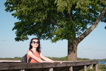 The girl inspects the area from the observation deck.
