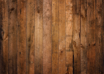Old dark barn wood background texture. Vintage weathered rough planks backdrop.