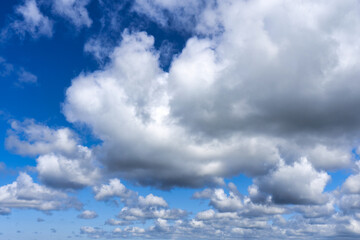 White cumulus clouds on blue sky background, natural phenomenon