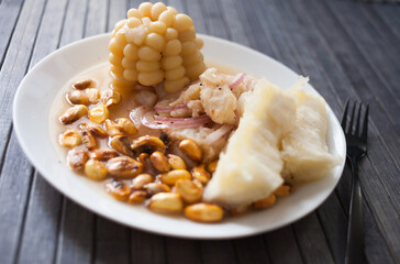 Peruvian traditional dish.fish ceviche with yuka and corn