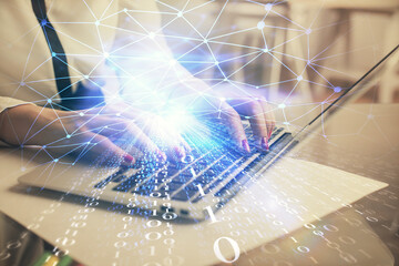 Multi exposure of woman hands working on computer and data theme hologram drawing. Tech concept.