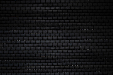 Black brick wall texture, brick surface for background. Vintage wallpaper.