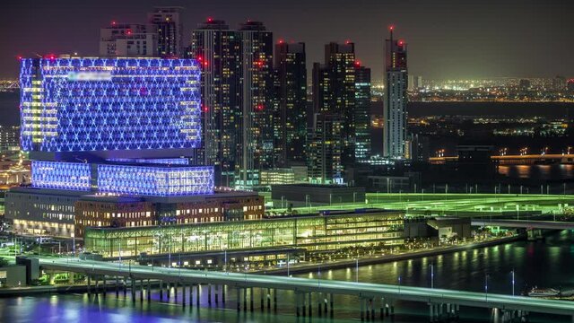 Aerial skyline of Abu Dhabi city centre from above day to night timelapse