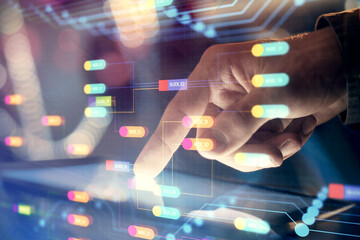 Multi exposure of man's hand holding and using a digital device and data theme drawing. Innovation concept.