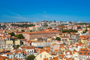 Fototapeta na wymiar An airplane fly over lisbon, the capital city of portugal