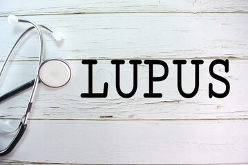 Stethoscope and background written LUPUS. Selective focus. Had a little big noise some area.