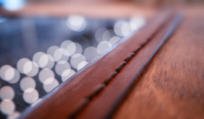 Wooden cafe purse for bills bokeh background