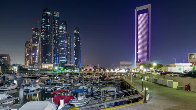 Al Bateen marina Abu Dhabi day to night timelapse with modern skyscrapers on background