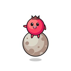 illustration of cranberry cartoon sitting on the moon