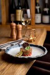 Seafood restaurant tartar with fresh raw fish and strawberry, modern fusion cuisine