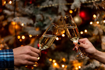 New year's eve, people clinking glasses of champagne, festive atmosphere