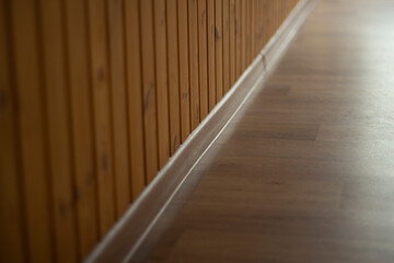 Skirting board in the room. The joint between the wall and the floor.